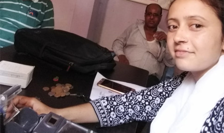 Girls sell urea at Biscomaun surging sale counters