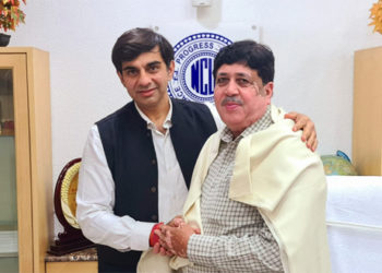 Wing Commander Dr Magon greets NCUI Prez