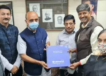 Minister gifted Lokmanya Co-op Coffee Table Book