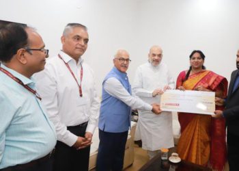 Repco Bank team presents dividend cheque to Shah