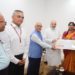 Repco Bank team presents dividend cheque to Shah
