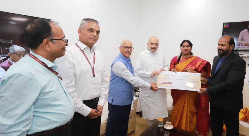 Repco Bank team presents dividend cheque to Shah