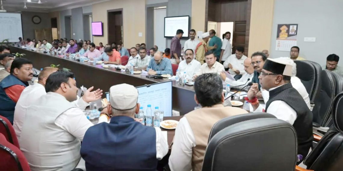 Sarang reviews co-op development with stakeholders at DM office