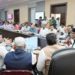 Sarang reviews co-op development with stakeholders at DM office