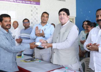Celebrating IYC 25: Amreli DCCB distributes ATM card