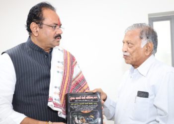 Amin presents book on Gujarat Co-op Law to Minister